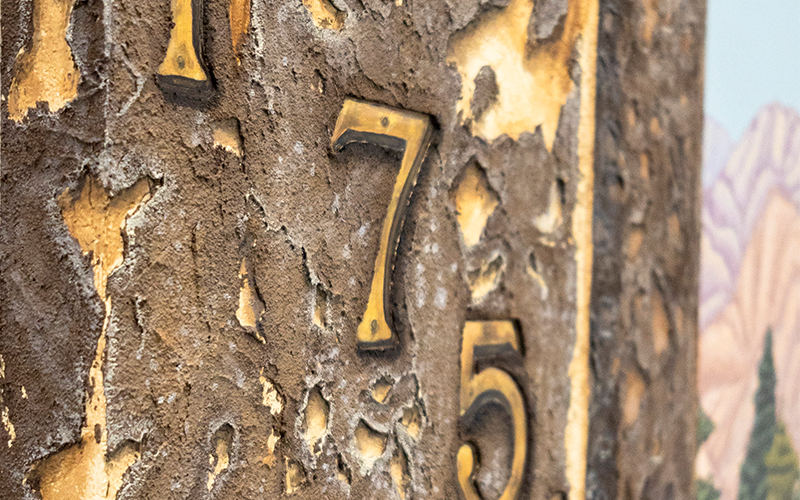 Close up of a mixed media artwork with numbers.