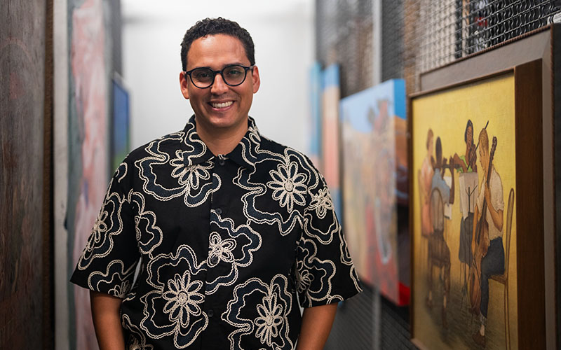 Man standing in front of artwork.