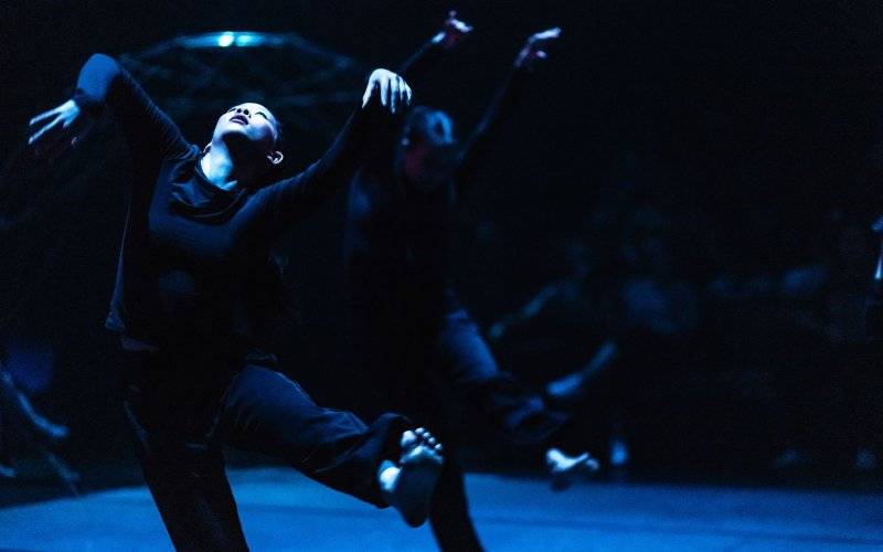 Dancers perform on stage