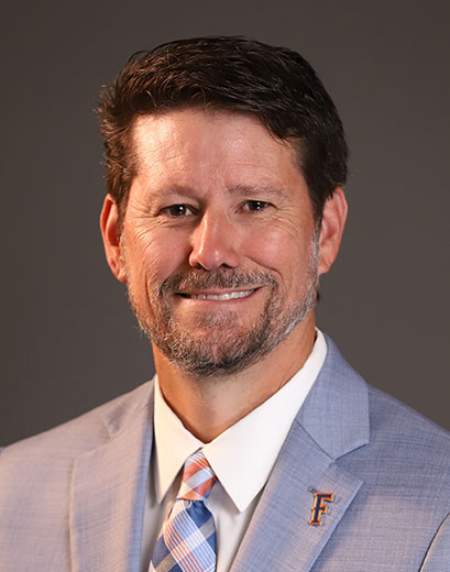 Chuck Kissel in gray suit