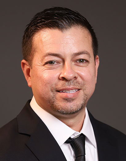 Daniel Gaytan in a black suit