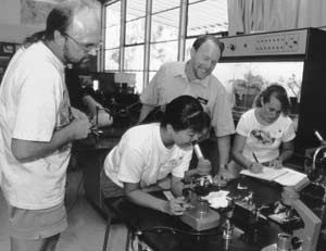 Professor with students in lab