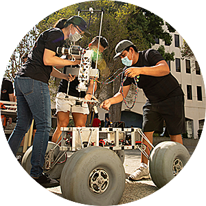Group of engineering students working on Mars rover