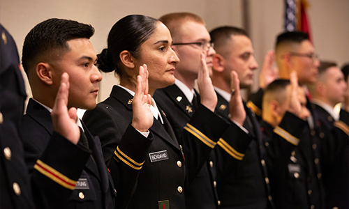  ROTC Students raise right hand durring swearing in ceremony