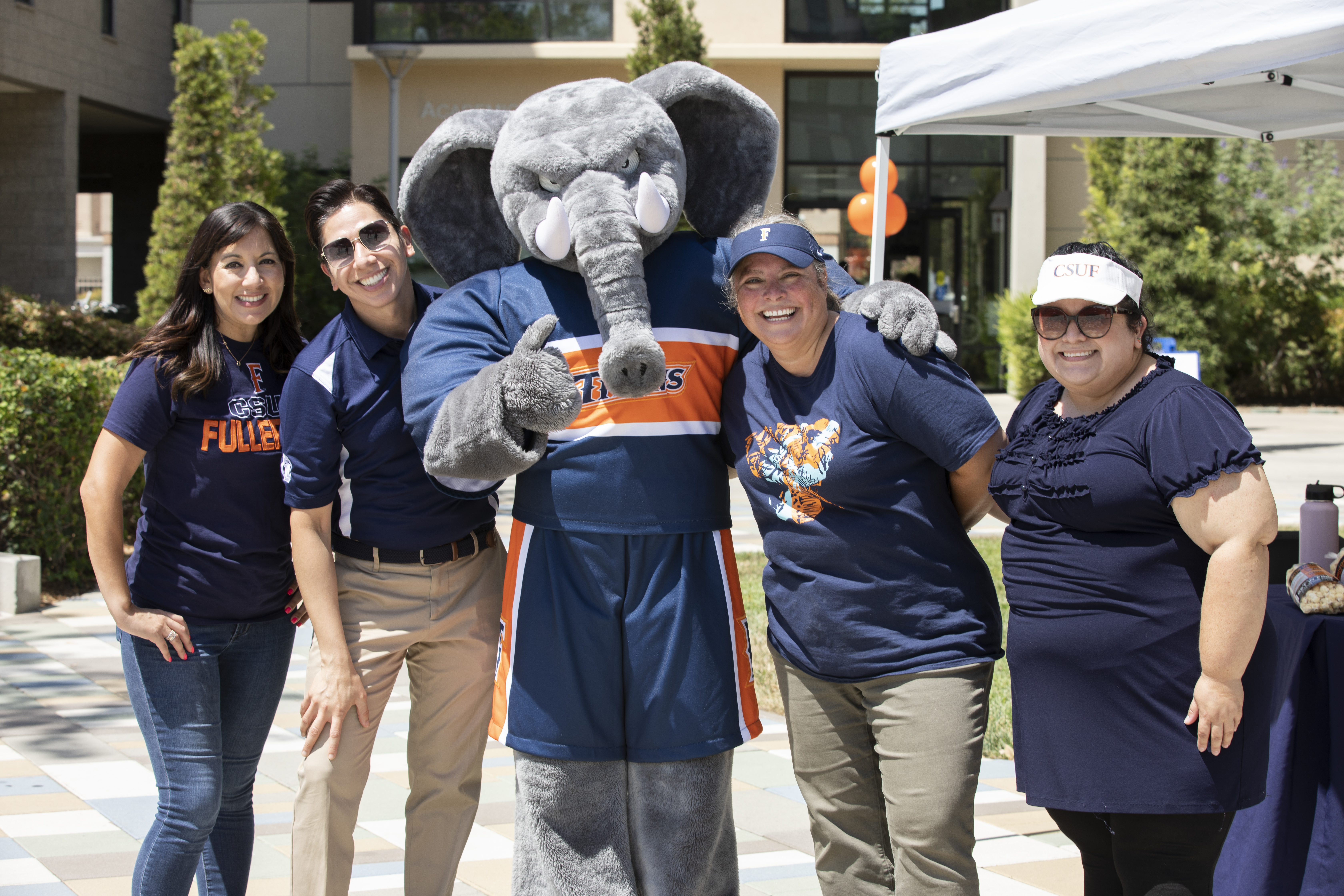 Staff smiling with Tuffy
