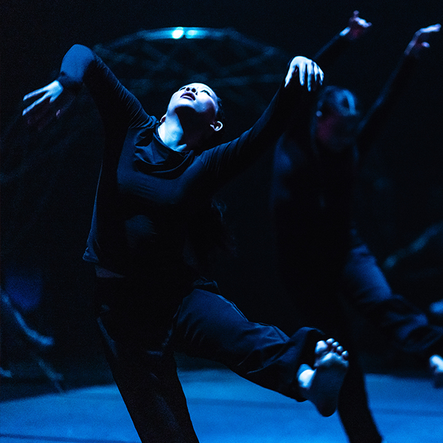 Dancers with legs and arms akimbo.