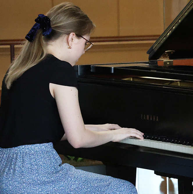Woman playing the piano.