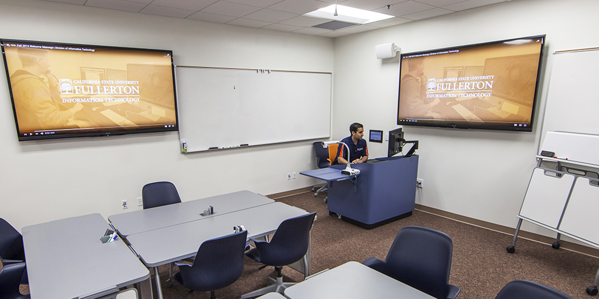 IT staff member sits at the podium in PLS 240