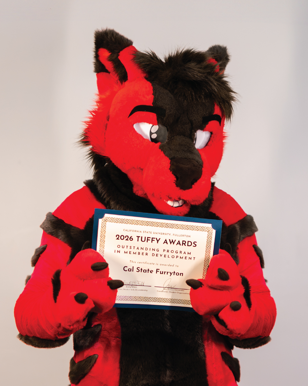 Student Holding Award for Outstanding Program in Student Development