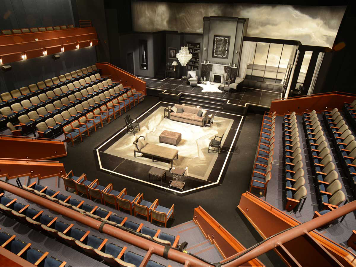Theatre with staged set and seating.