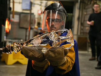 Student holding glass vessel 