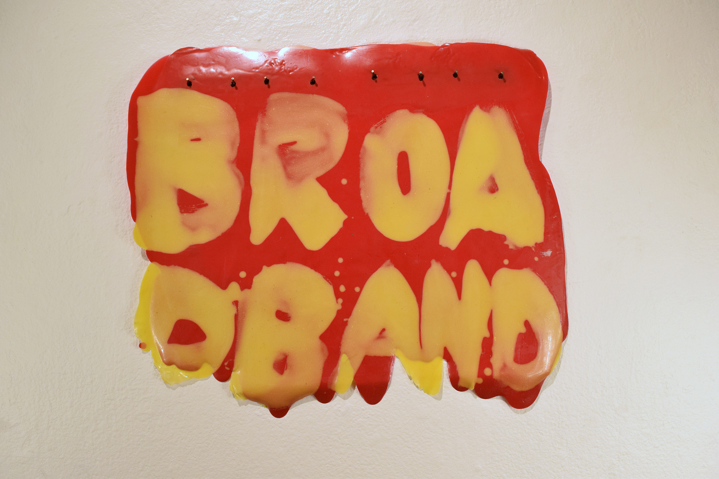 Words 'Broad Band' hung on a wall