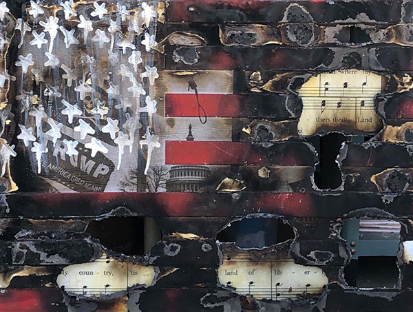 Painting of American flag with burn marks