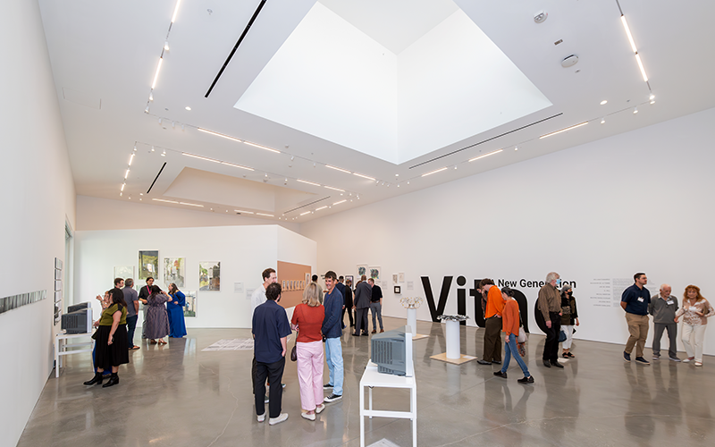 Modern gallery space with people.