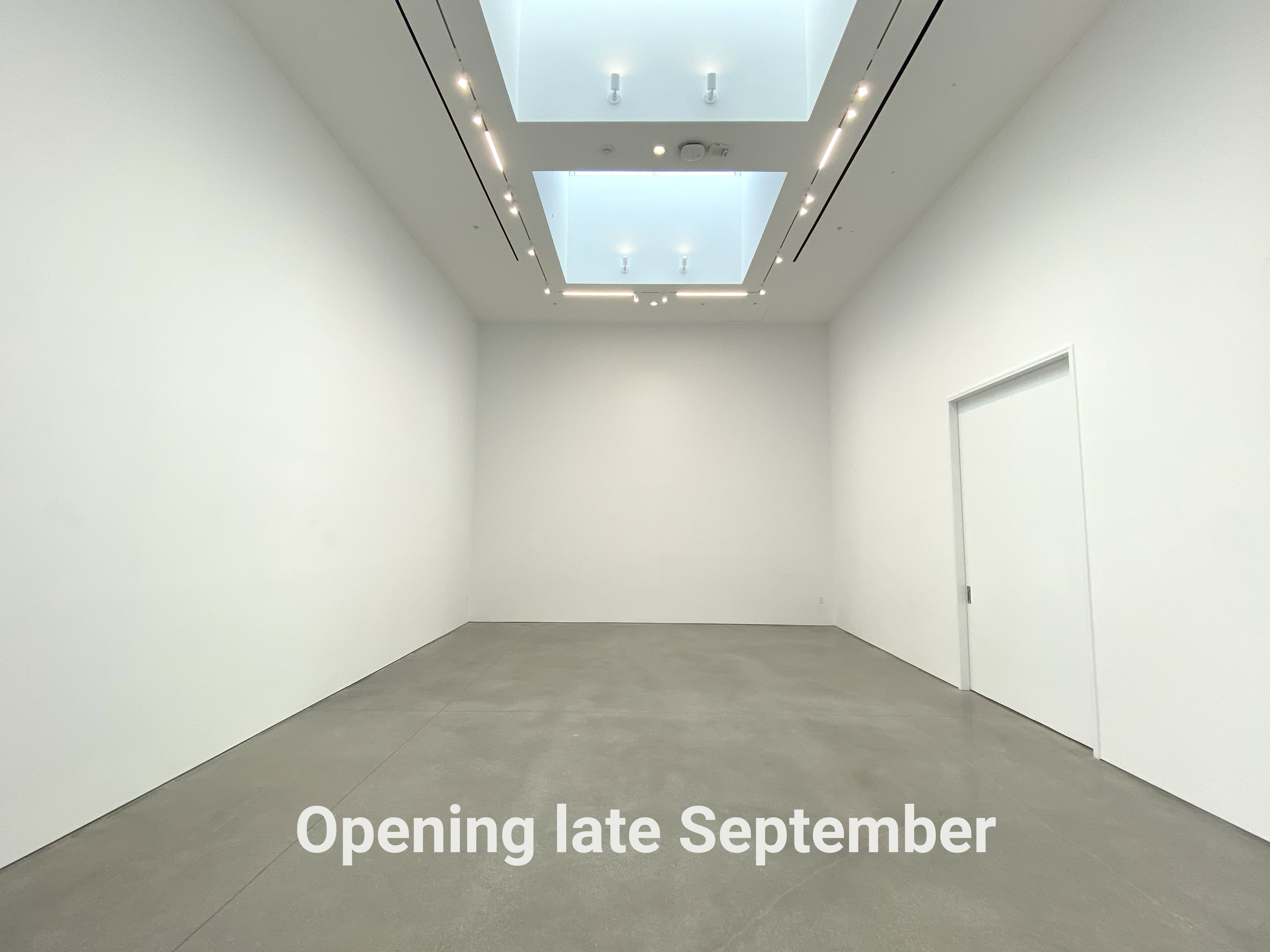 Empty gallery with the words "Opening late September"