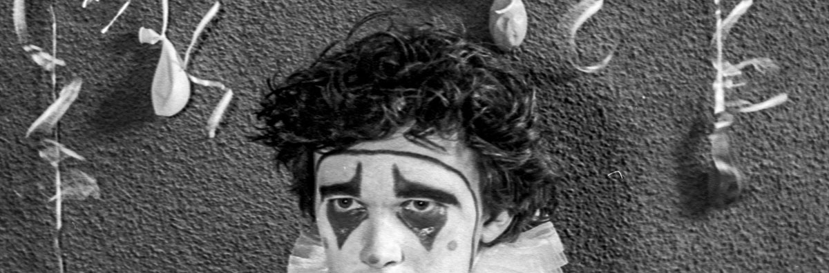 Partially visible face of a clown.