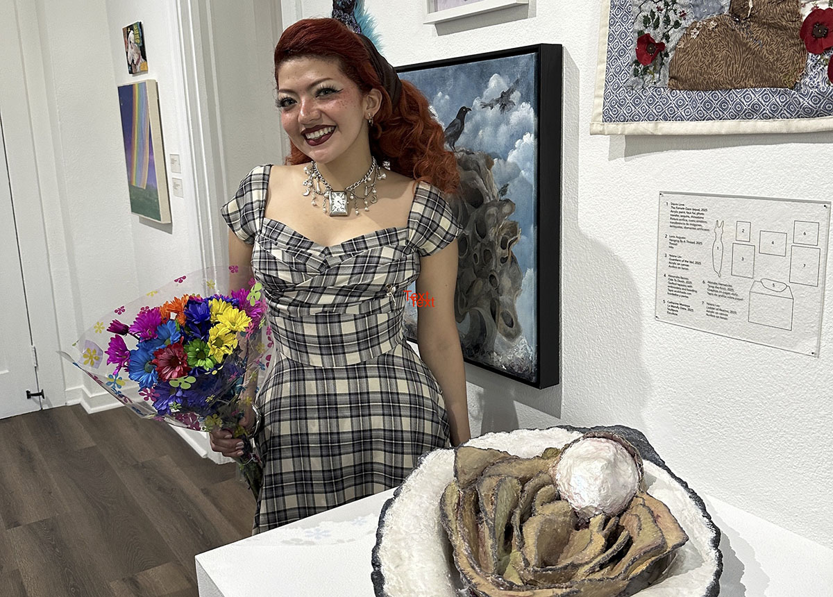 Woman with red hair smiling.