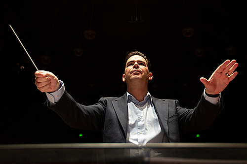 Professor Dustin Barr conducting a symphony
