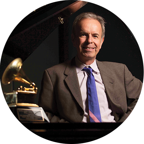 Music professor Bill Cunliffe posing with Grammy award