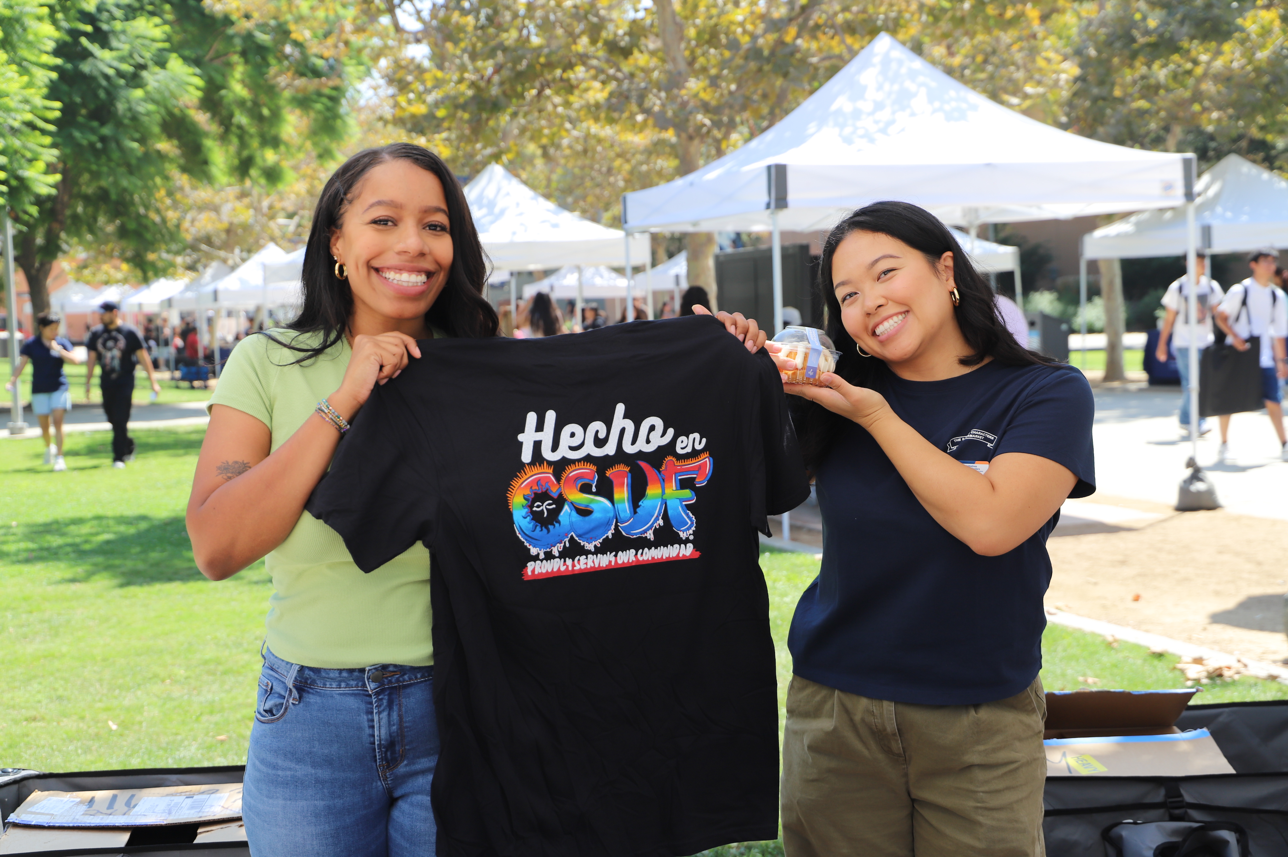 picture of two staff members smiling