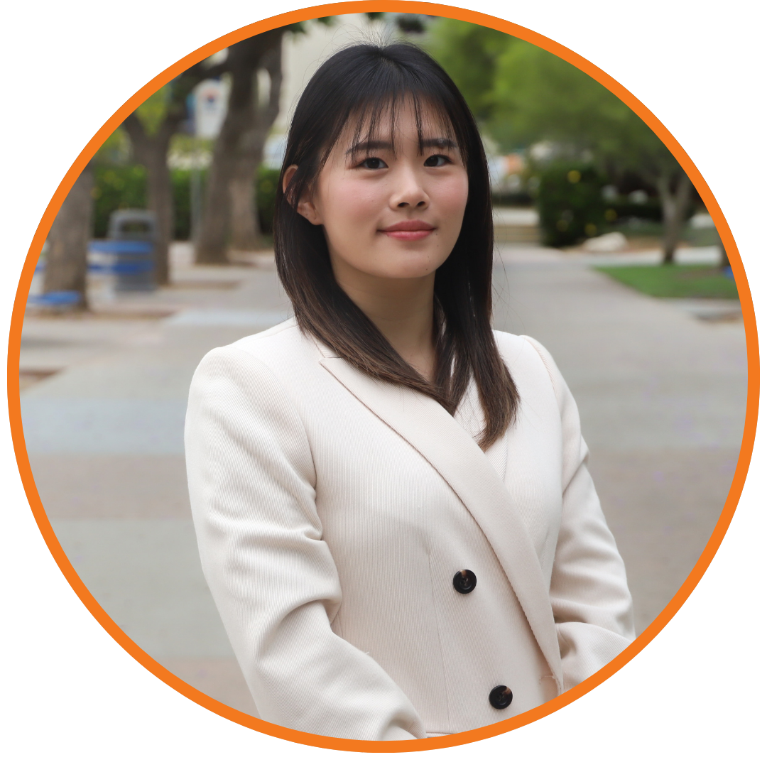 person smiling in white blazer
