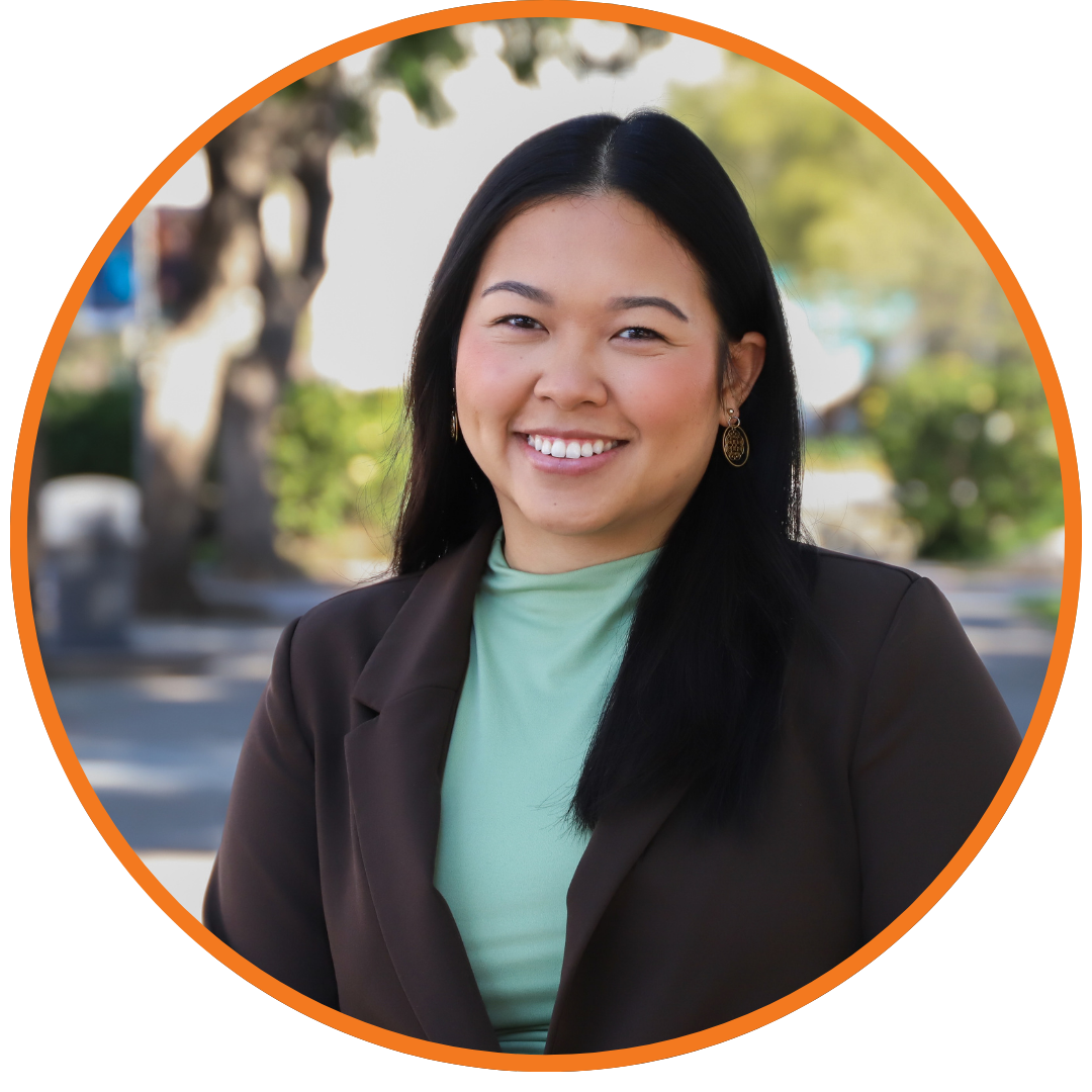 person smiling with dark blazer