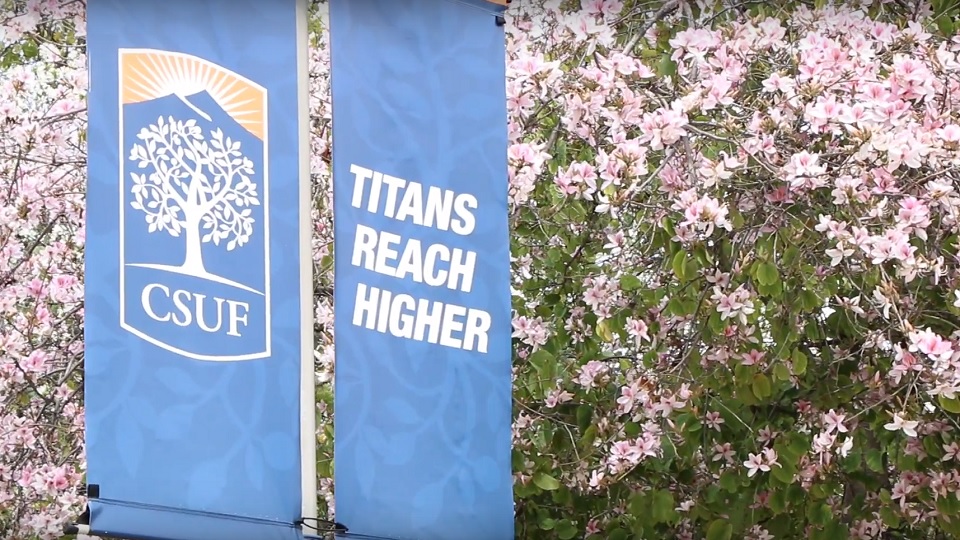 Flowers surround a Titans Reach Higher banner