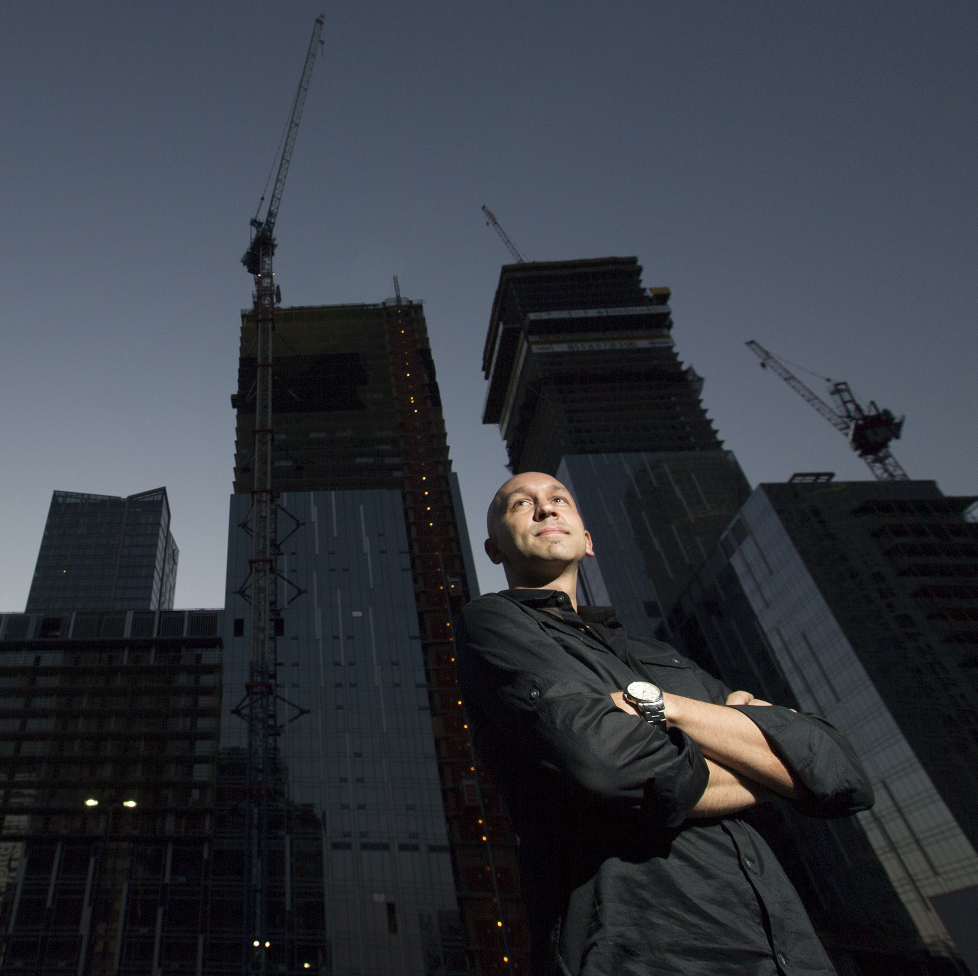 Kristijan Kolozvari standing under a skyline