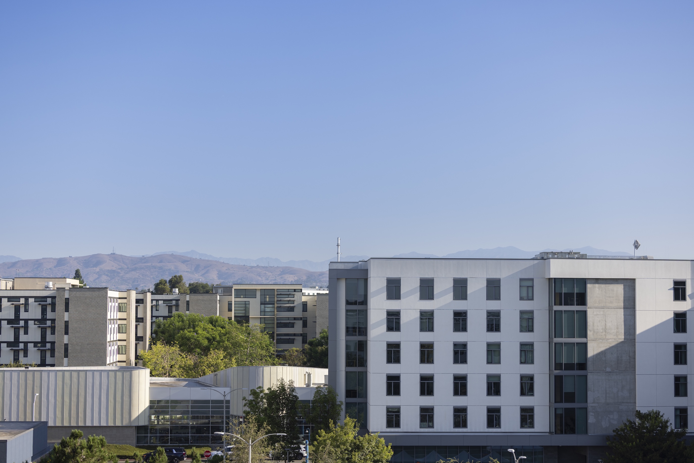 exterior shot of suites and residence halls with blue sky