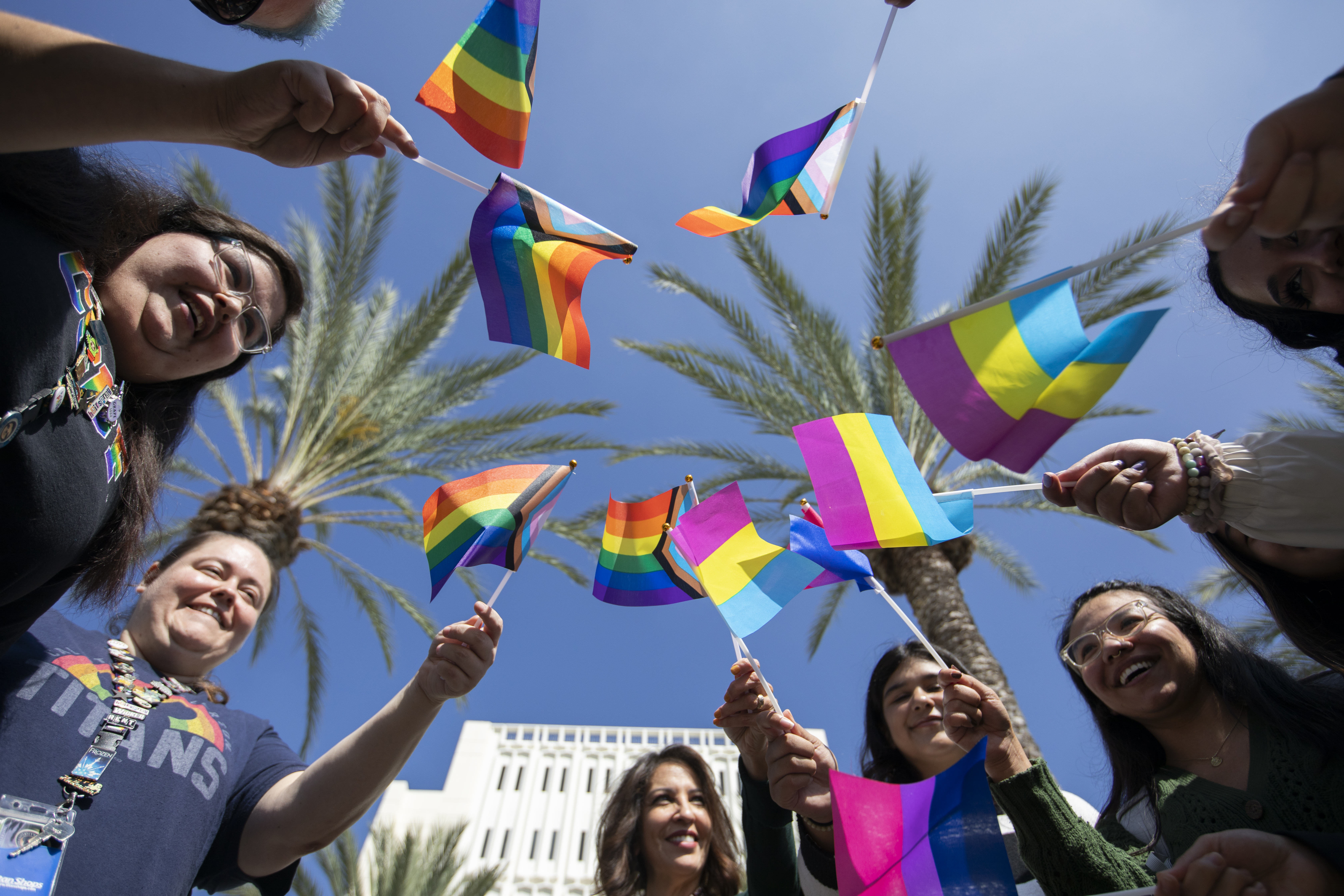group of people with pride flags
