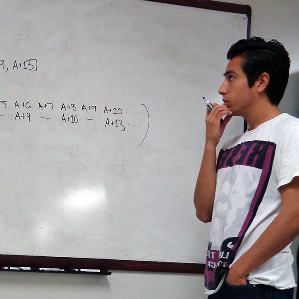 Ulysses Alvarez working on the whiteboard