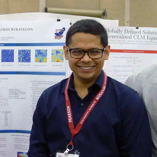 Alejandro Camacho presenting his research poster Alejandro Camacho