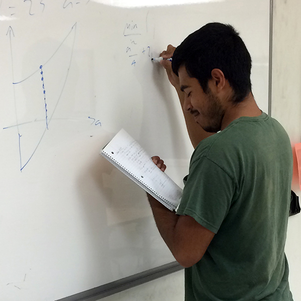 Joseph Chavoya Joseph Chavoya writing on the board