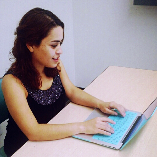 Mirna Dominguez Mirna Dominguez typing on her computer