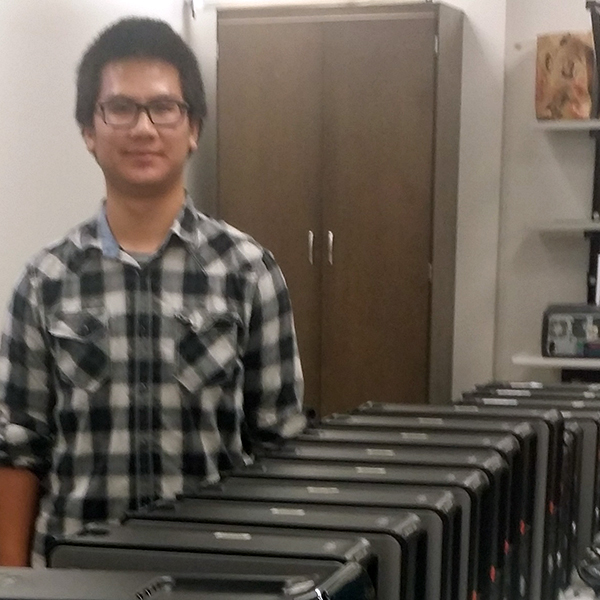 Waymon Ho Waymon Ho standing next to several Dell servers