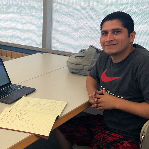 Erick Ortega Erick Ortega posing next to his notebook