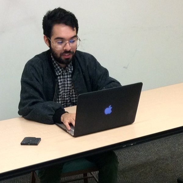 Erick Venegas Erick Venegas analysing data on his computer