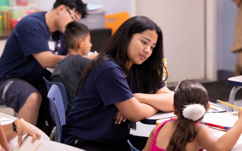 CSUF student with elementary student
