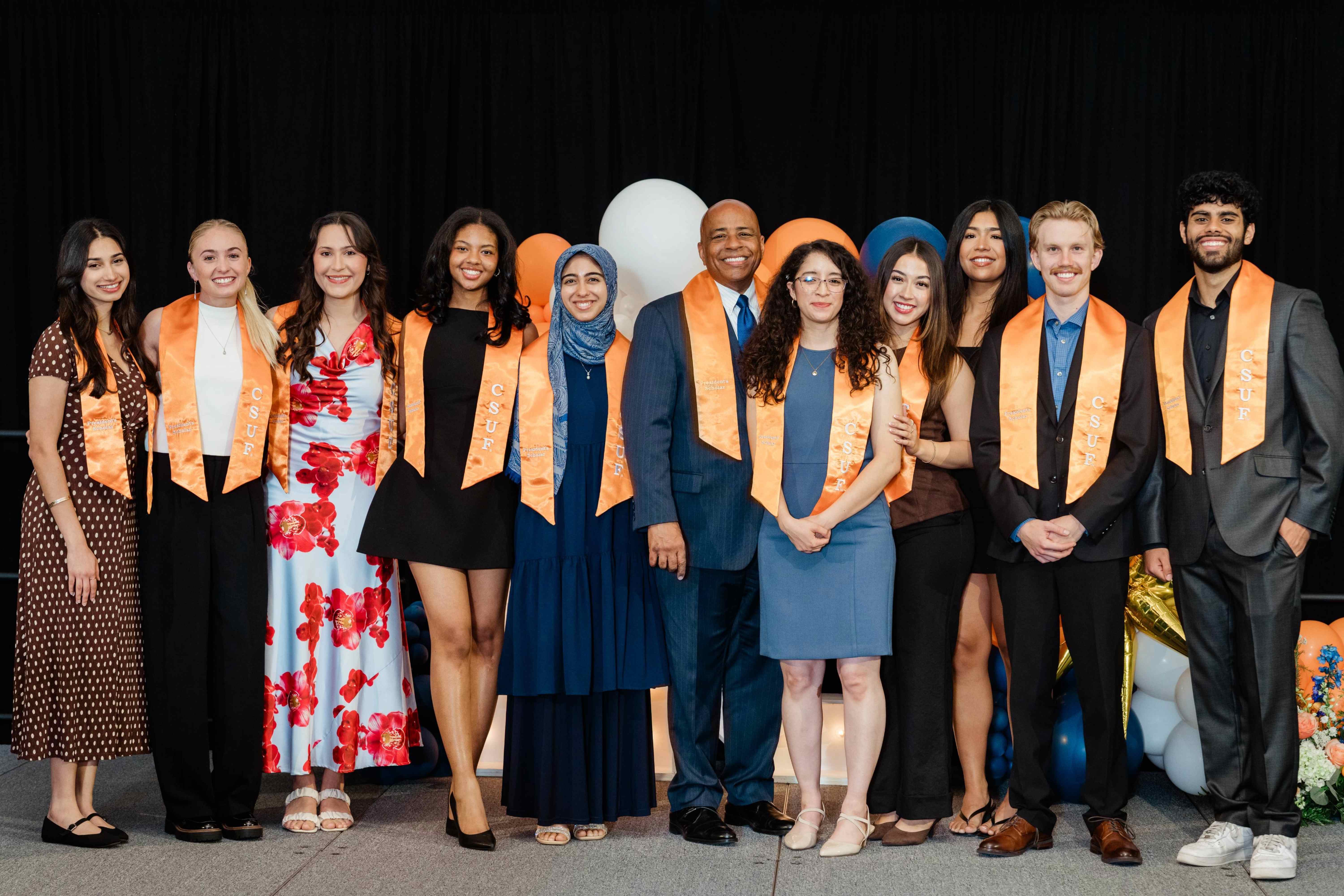 Group photo of the President and Graduating Scholars