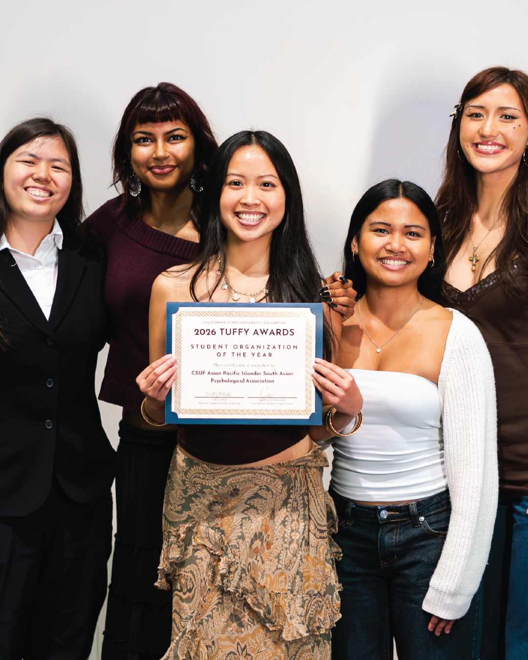 Students holding the award for Organization of the Year