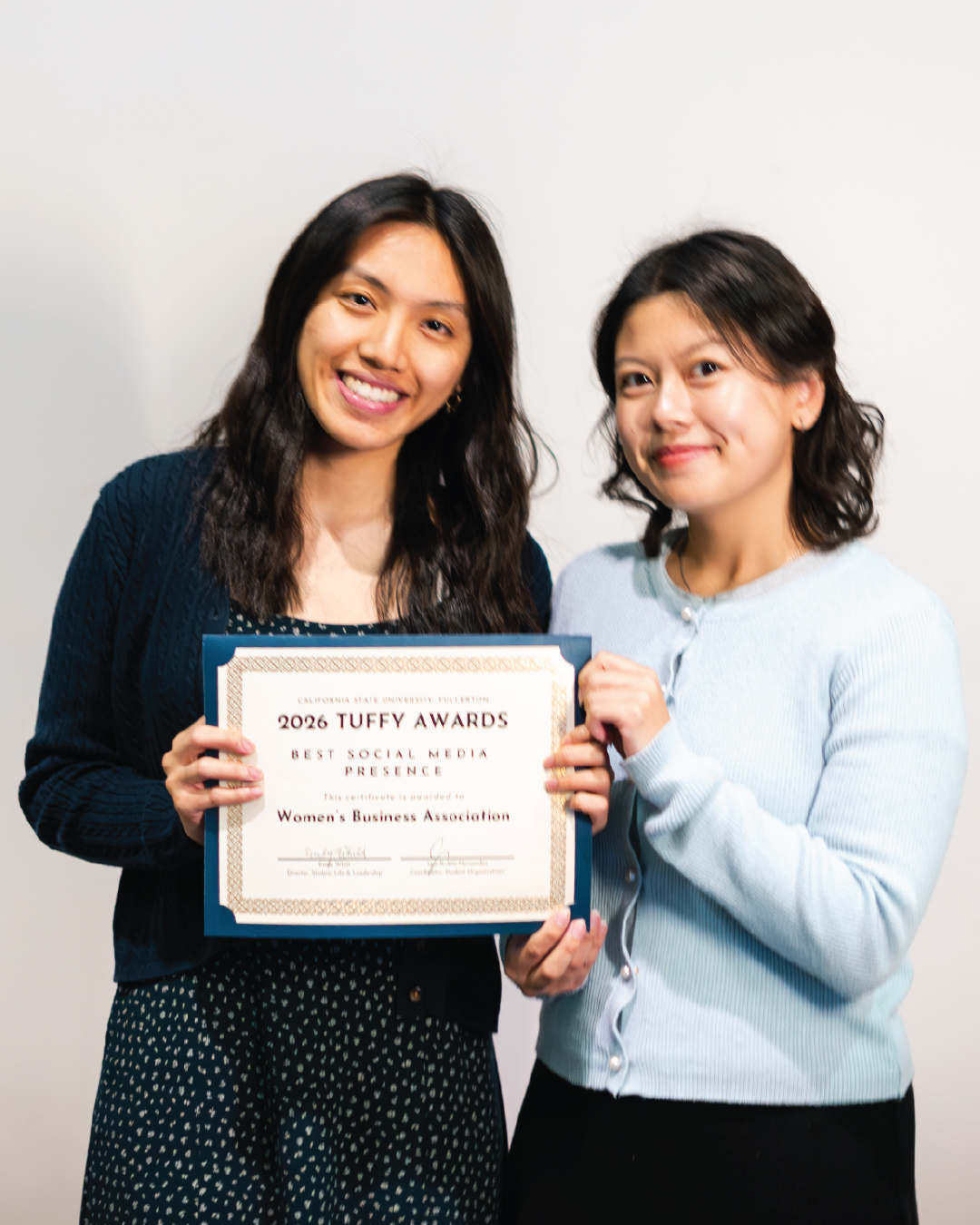 Students holding an award for Best Social Media Presence