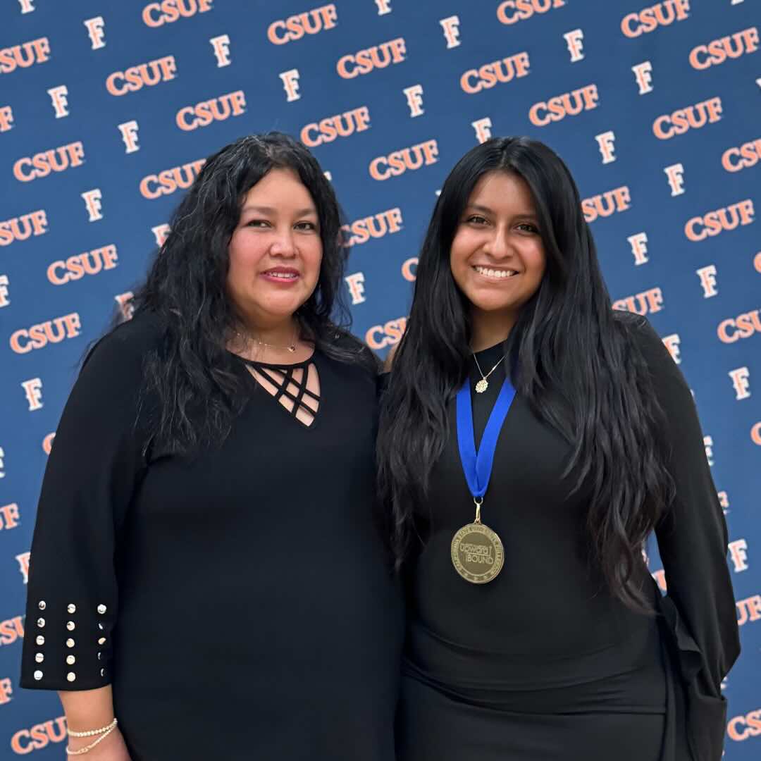 Student with their guest at the Upward Bound Banquet