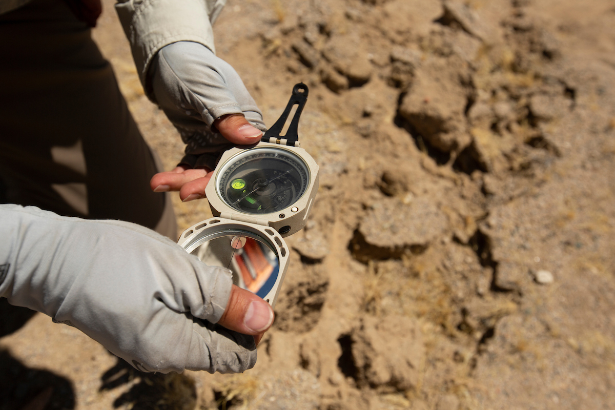 holding a compass 