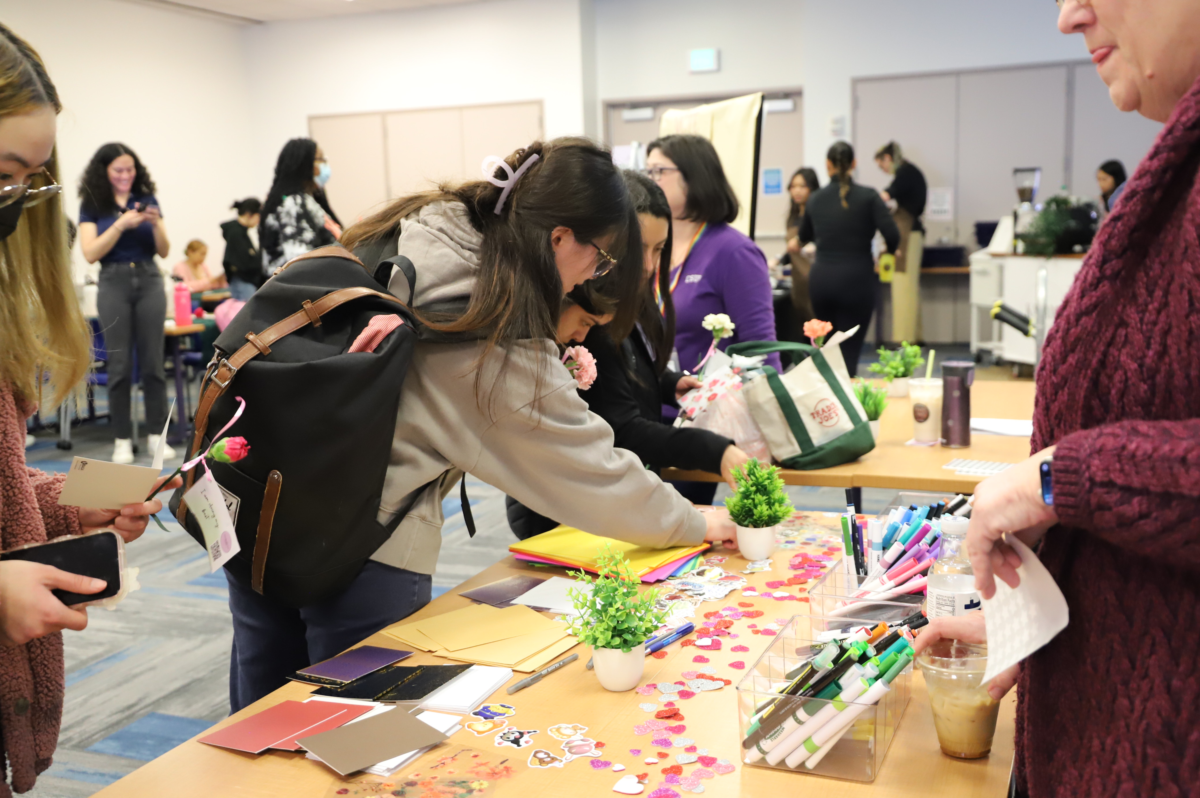 People crowding a table